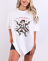 Model wearing white color shirt with 'Tis The Season' funny cowboy Santa Claus graphic design